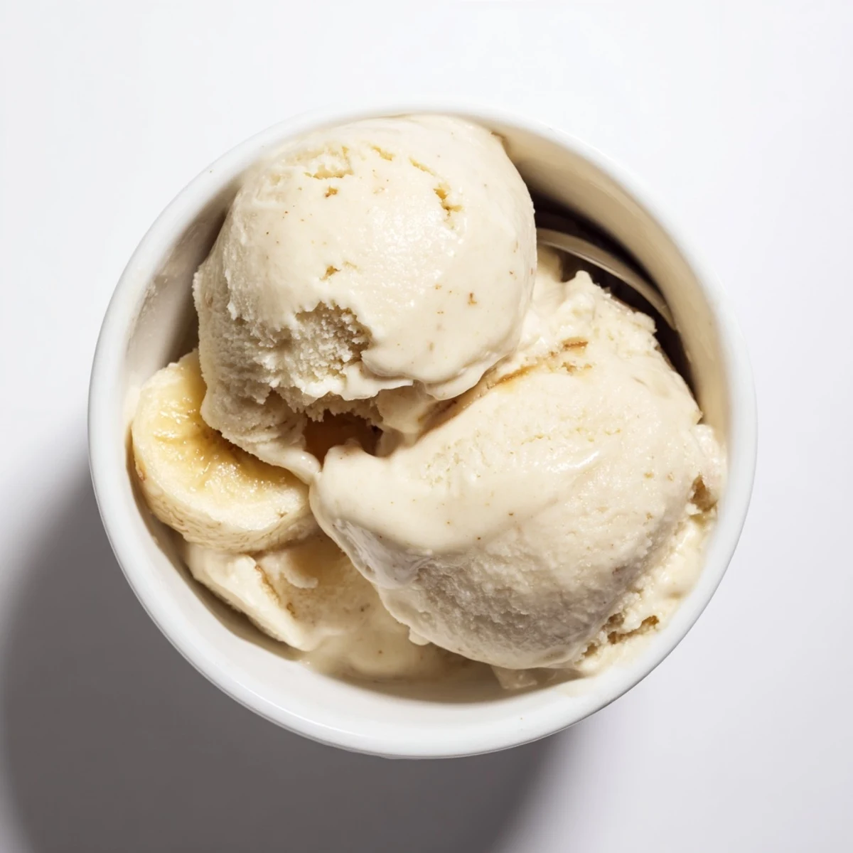 A swirl of 2-Ingredient Banana Ice Cream offers a smooth texture, perfect for a refreshing treat.
