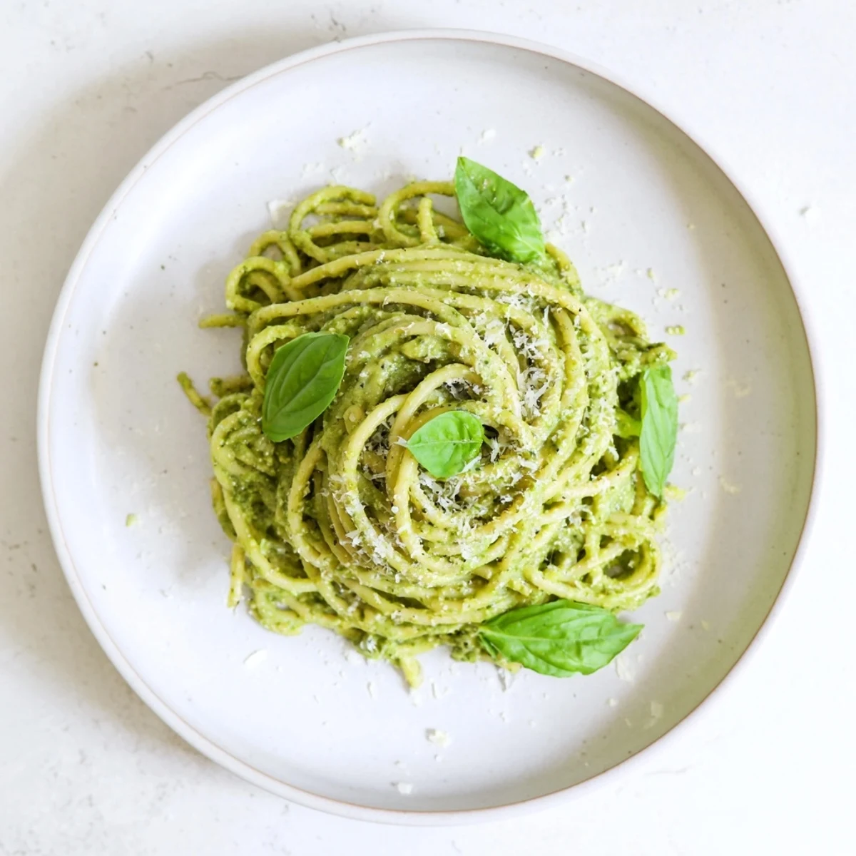 Creamy Sunflower Seed Pesto Pasta tossed with al dente noodles and vibrant green pesto, ready to serve.  