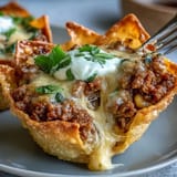 Crispy wonton wrappers cradle savory filling in these delicious Mini Taco Cups.