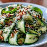 Lemon Parmesan Zucchini Ribbon Salad with fresh basil, a summery delight.