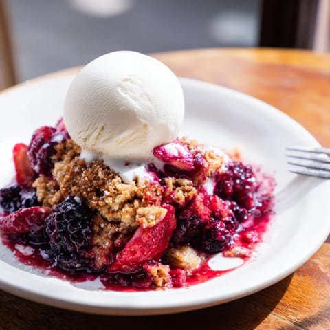 Freshly baked Rustic Summer Berry Cobbler: a delightful mix of berries with a sweet, biscuit topping.