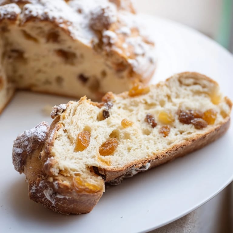 Homemade cinnamon swirl raisin bread: a soft, pillowy loaf with visible raisins ready to enjoy.
