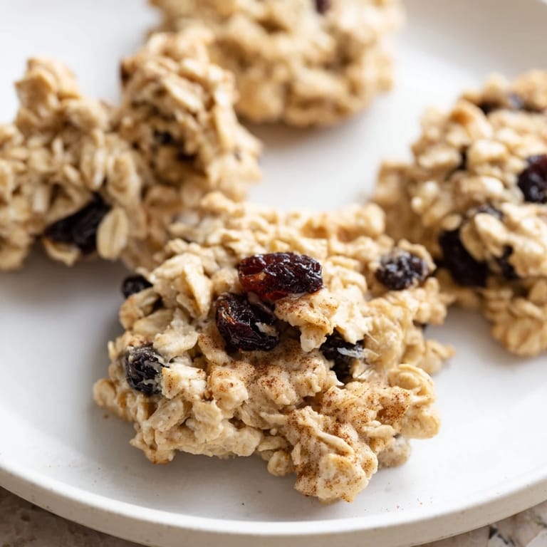 Delicious homemade oatmeal raisin breakfast cookies, golden brown and perfectly baked for a sweet treat.