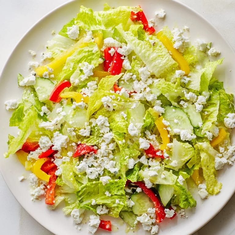 Close-up of a refreshing Bella Hadid Salad, ready to serve with bright, crunchy vegetables.